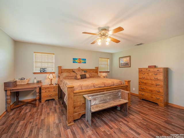 bedroom featuring ceiling fan and dark wood-type flooring