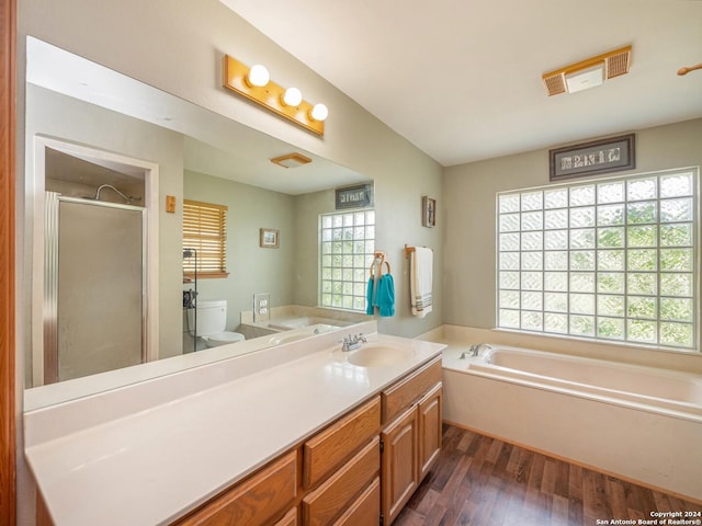 full bathroom with hardwood / wood-style flooring, vanity, toilet, and shower with separate bathtub