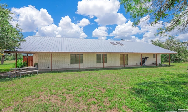 back of house with a yard