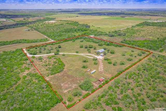 birds eye view of property featuring a rural view