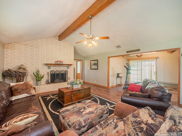 living room featuring hardwood / wood-style flooring, vaulted ceiling with beams, ceiling fan, and a fireplace