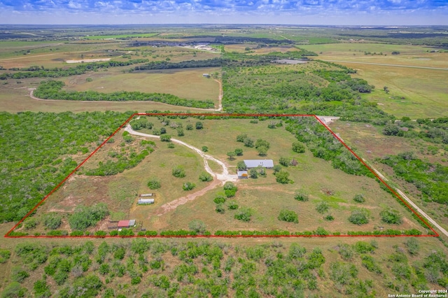 birds eye view of property with a rural view