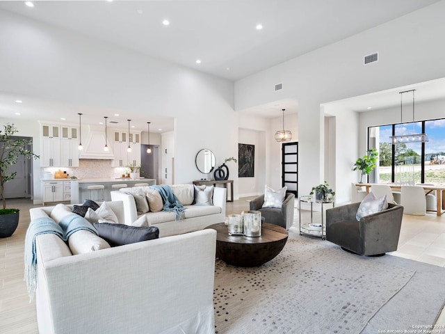 living room with a towering ceiling