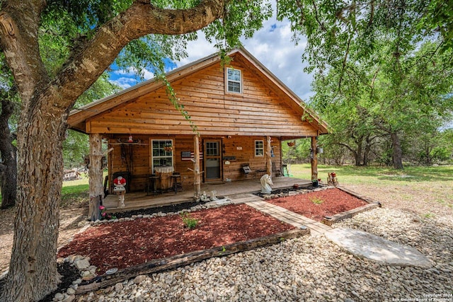 rear view of house with a porch