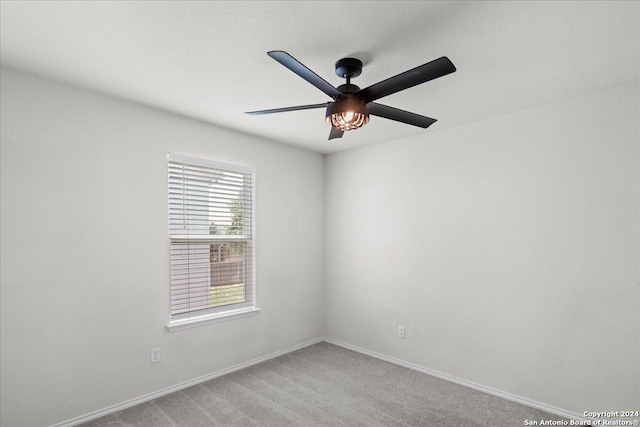 carpeted empty room with ceiling fan