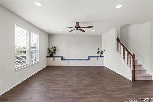 unfurnished living room featuring ceiling fan