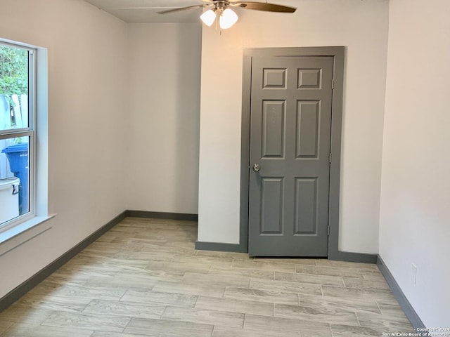 spare room featuring ceiling fan and light hardwood / wood-style flooring