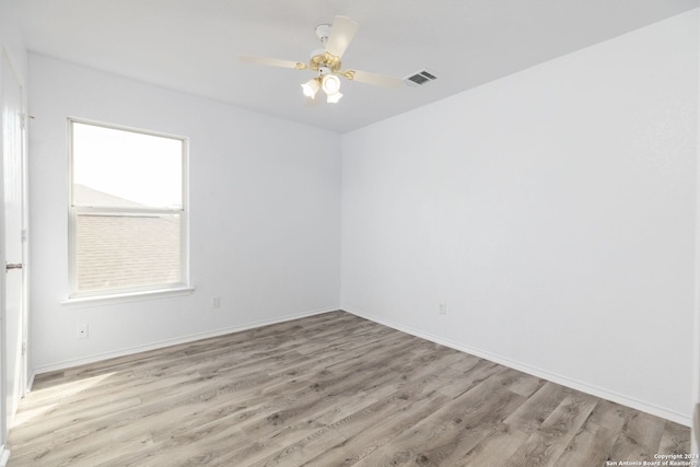 spare room featuring ceiling fan and light wood-type flooring