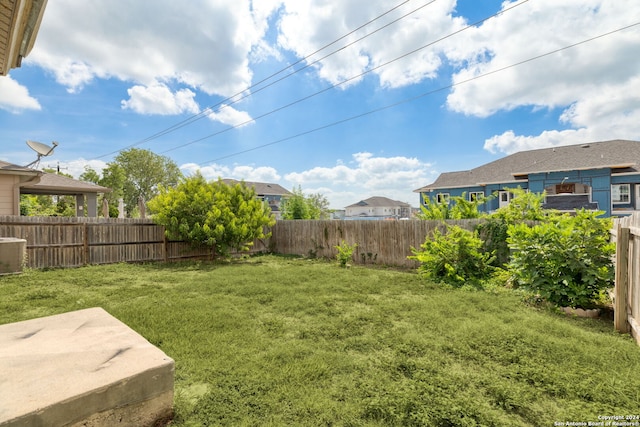 view of yard featuring central AC unit