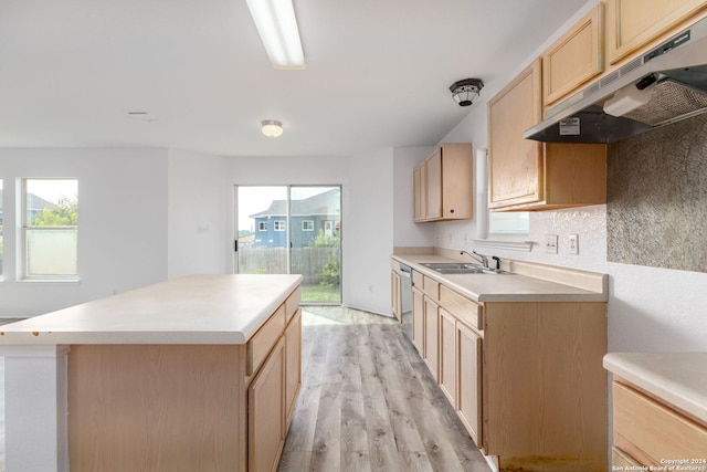 kitchen with sink, a center island, light wood-type flooring, light brown cabinets, and dishwasher