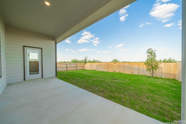 view of yard with a fenced backyard and a patio area