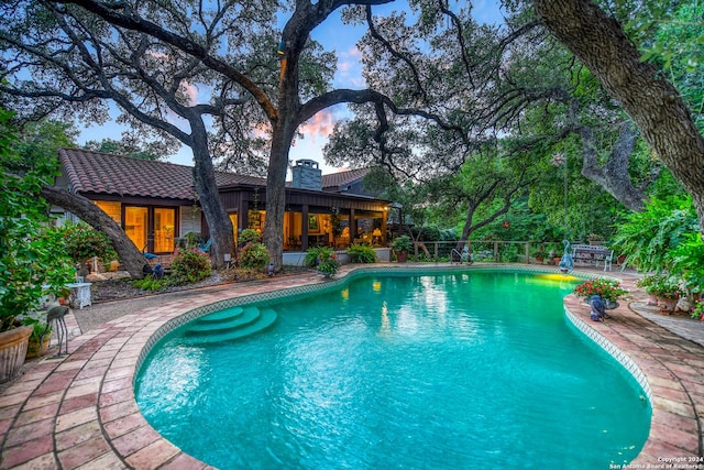 view of swimming pool featuring a patio area