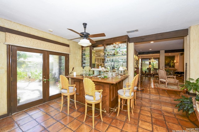 bar featuring ceiling fan and french doors