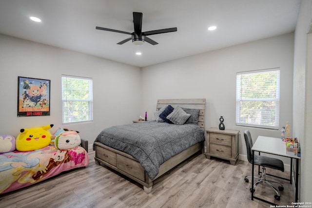 bedroom with baseboards, light wood finished floors, a ceiling fan, and recessed lighting