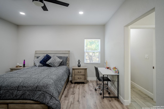 bedroom with light wood-style floors, recessed lighting, and baseboards