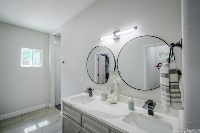 bathroom featuring dual bowl vanity