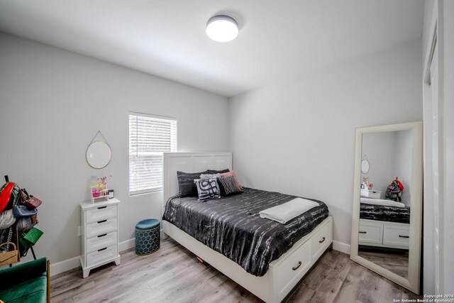 bedroom featuring light hardwood / wood-style floors