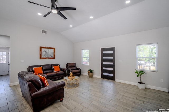 living room with recessed lighting, visible vents, baseboards, vaulted ceiling, and light wood-type flooring