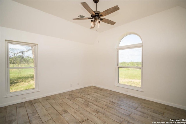 spare room with ceiling fan and wood-type flooring