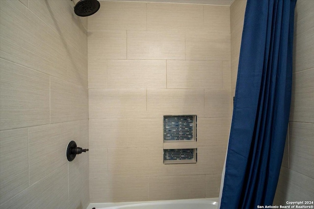 bathroom with a shower with shower curtain