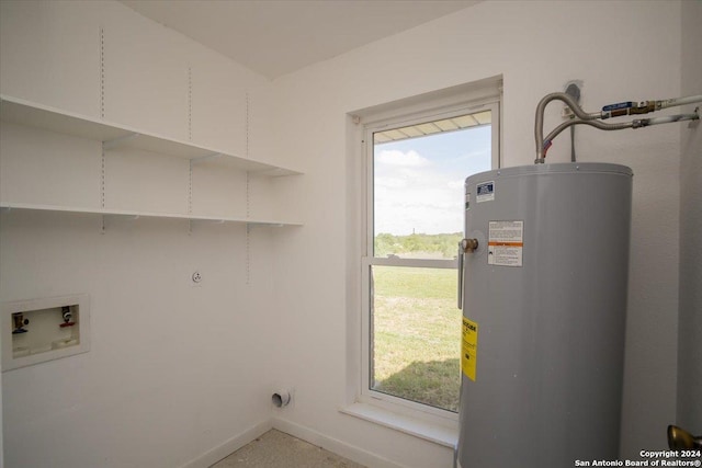 laundry room featuring water heater, hookup for a washing machine, and electric dryer hookup