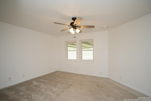 carpeted empty room with ceiling fan