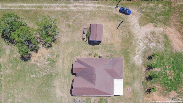 birds eye view of property with a rural view