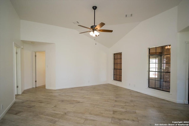 spare room featuring vaulted ceiling and ceiling fan