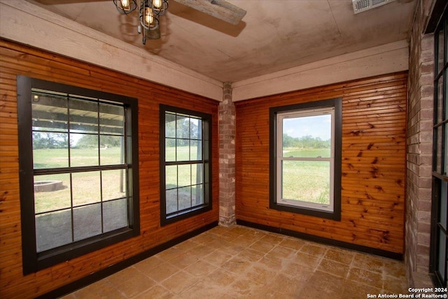 doorway featuring wood walls