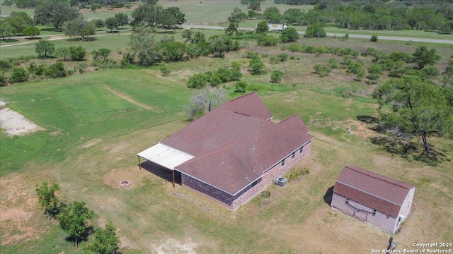 birds eye view of property featuring a rural view