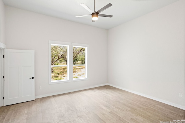 unfurnished room featuring ceiling fan and light wood-type flooring