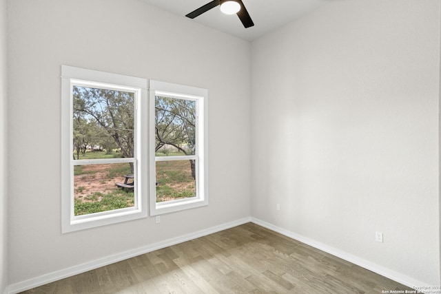 empty room featuring ceiling fan and hardwood / wood-style flooring