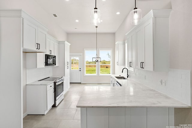 kitchen with decorative light fixtures, white cabinetry, decorative backsplash, sink, and stainless steel electric range oven