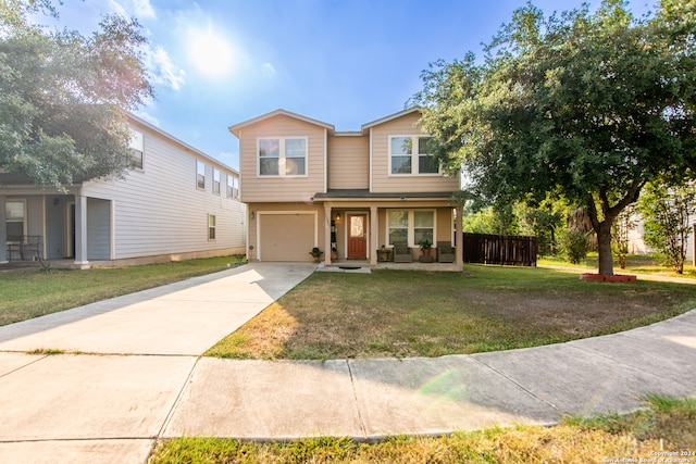 view of front facade featuring a front yard and a garage