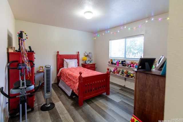 bedroom featuring dark wood-type flooring