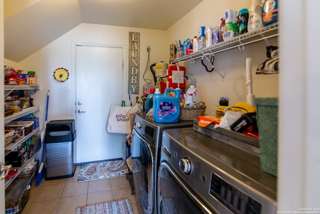 clothes washing area with tile flooring and independent washer and dryer