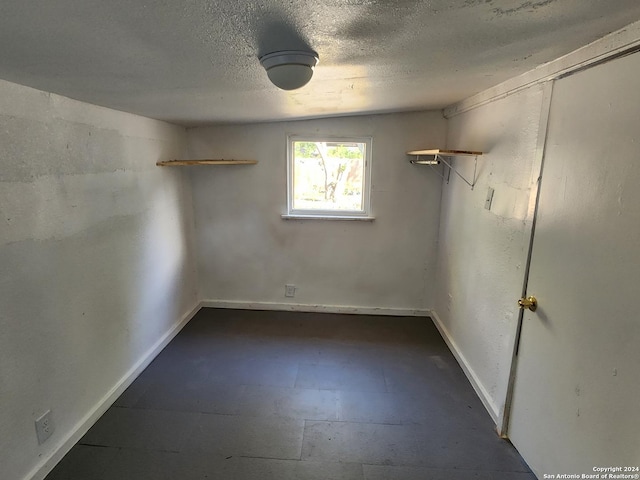 spare room featuring a textured ceiling