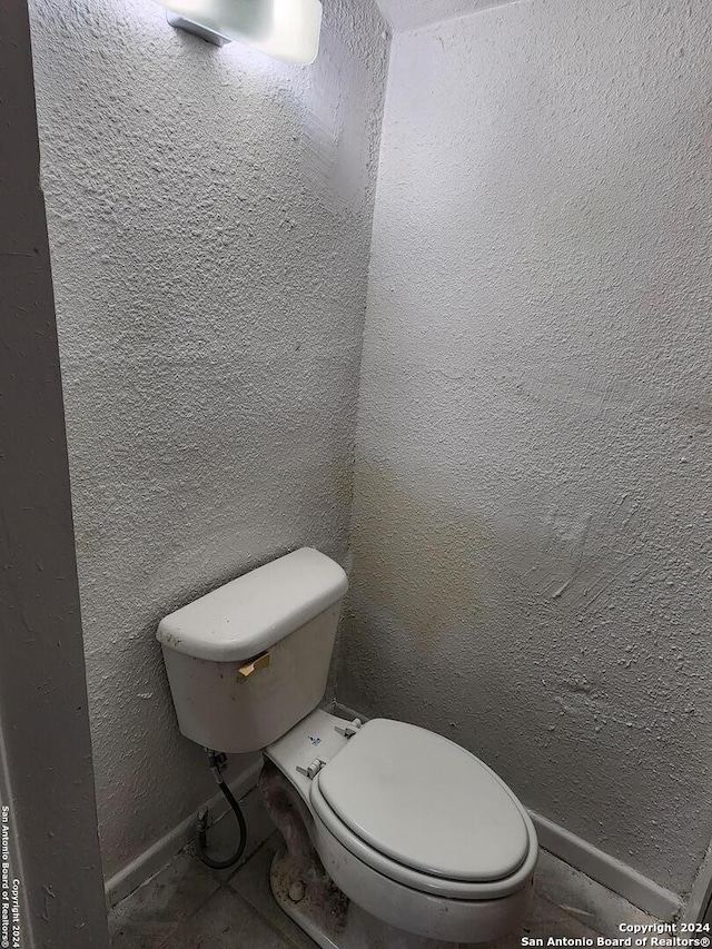 bathroom featuring tile patterned floors and toilet