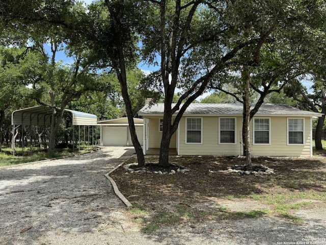 view of front facade with a carport