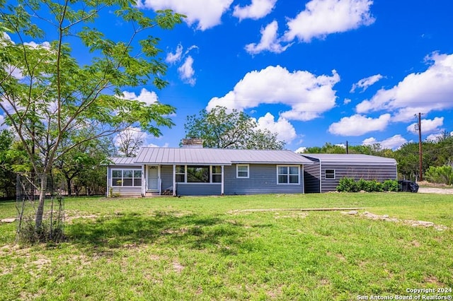 ranch-style house with a front yard