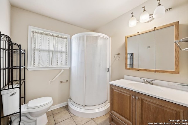 bathroom with toilet, vanity, tile patterned floors, and an enclosed shower