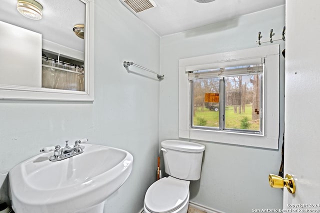 bathroom with toilet and sink