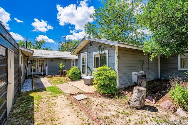 back of property featuring french doors