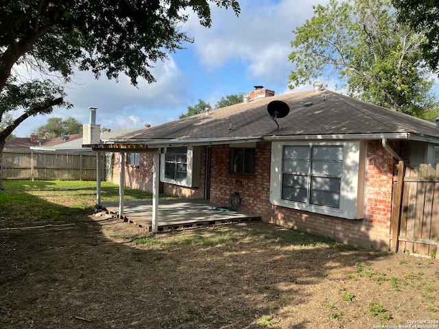 back of house with a yard