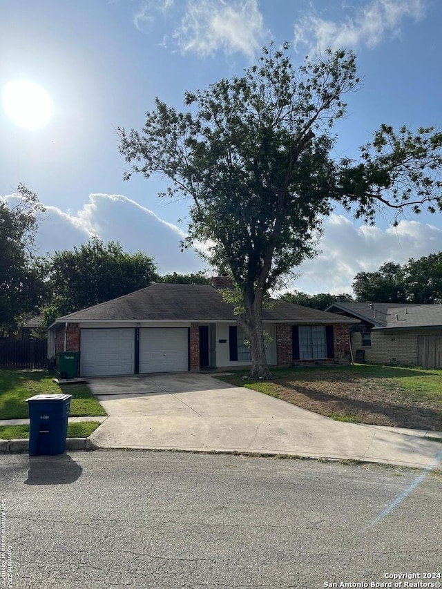 ranch-style home with a garage