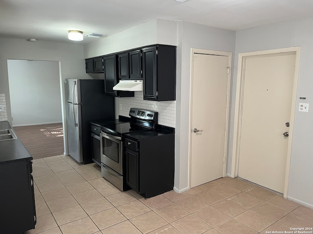 kitchen with sink, tasteful backsplash, light tile flooring, and stainless steel electric stove