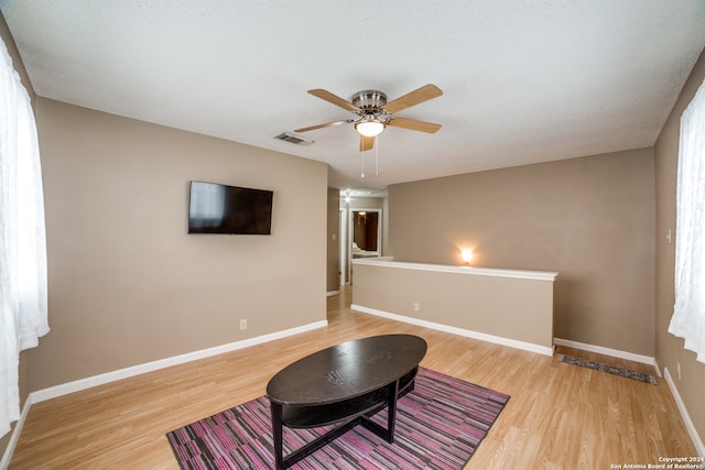 interior space featuring light hardwood / wood-style flooring and ceiling fan