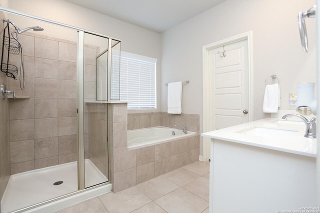 bathroom featuring vanity, tile patterned floors, and separate shower and tub