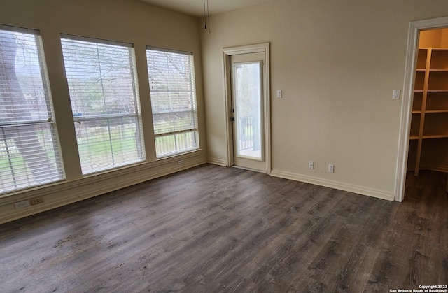 empty room featuring dark hardwood / wood-style floors