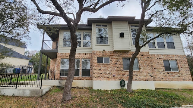 view of front of home with a balcony